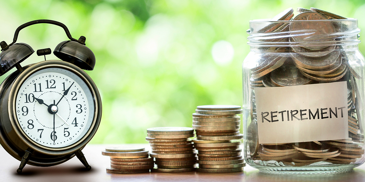 clock, coins and retirement jar full of coins